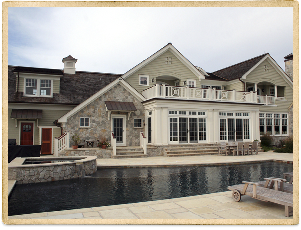 Beige two story with white trim and stone foundation