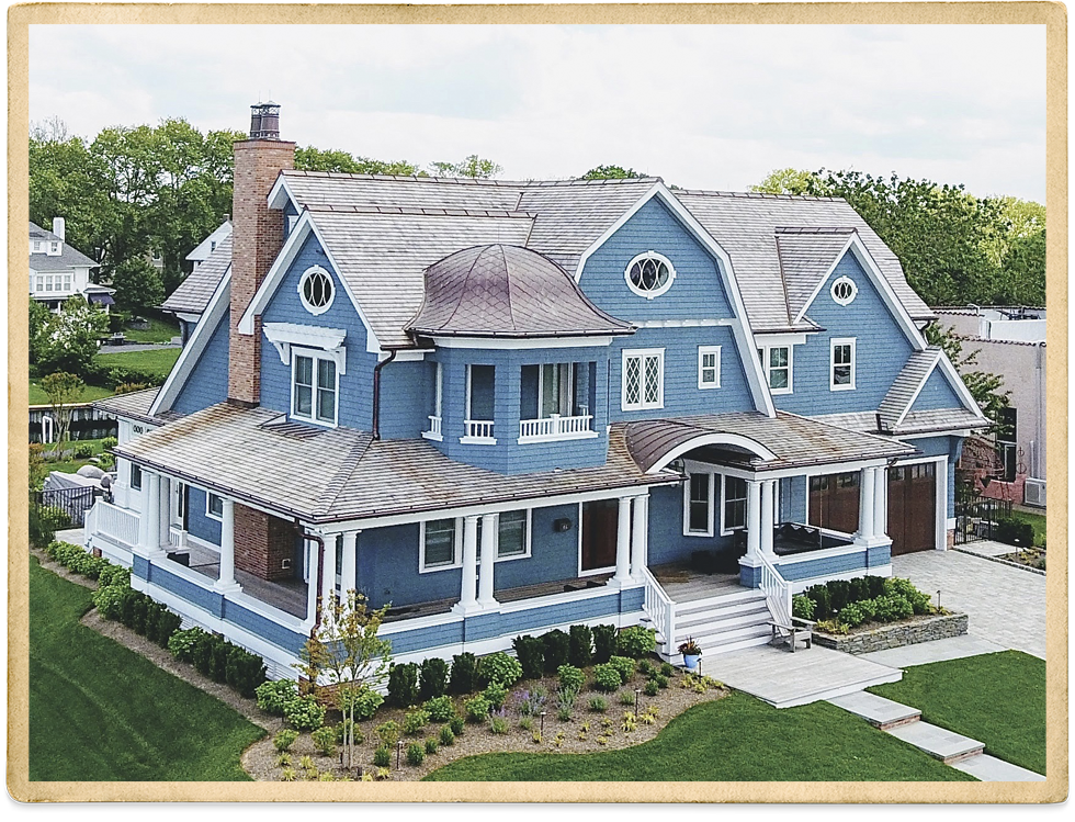 Two Story Blue Cedar Shake With White Trim