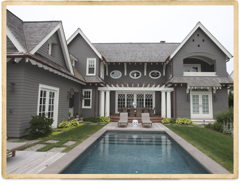 Gray Cedar Shake Two Story With White Trim And Columns On Front Porch