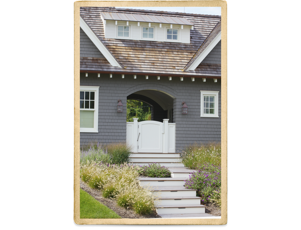 Gray Cedar Shake Two Story With White Trim And Columns On Front Porch