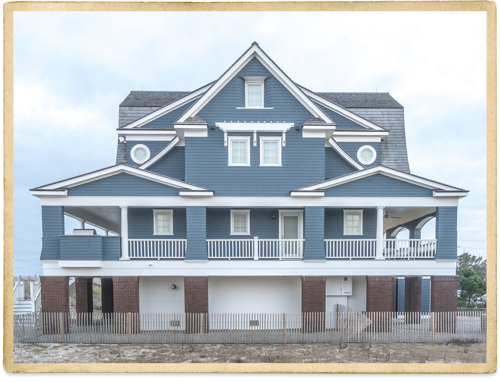 Two Story Blue Cedar Shake With White Trim