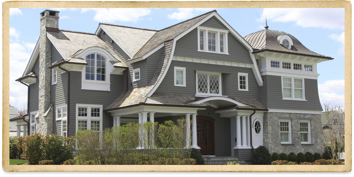 Gray two story with stone on first floor