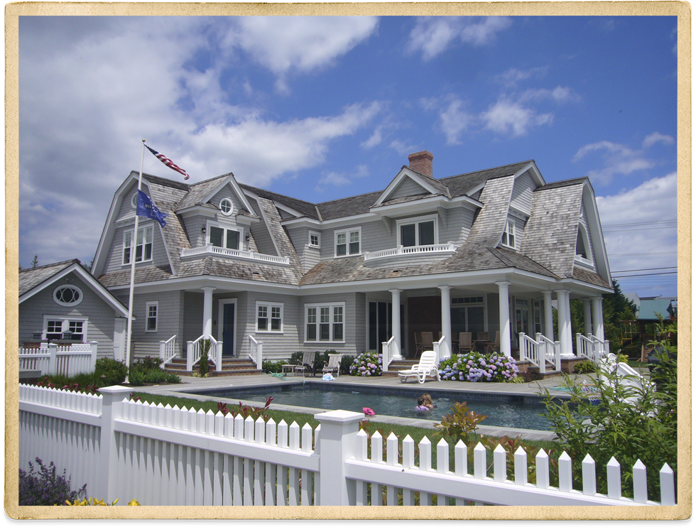 Beige two story with white trim and pool